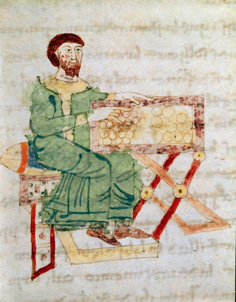 Medieval manuscript illustration of a seated money changer beside a table displaying coins.